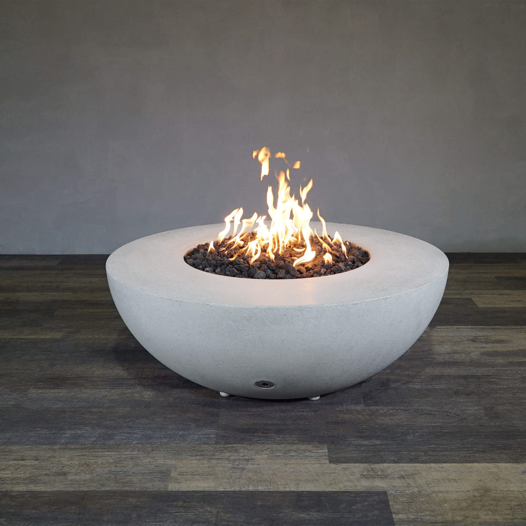 Front view of Starfire Designs Gravity 45" Round Rustic Gravity Concrete (GFRC) Fire Pit - Propane Gas Hardline - White with flames on, featuring sleek modern concrete bowl design and durable construction, perfect for outdoor patio spaces. Natural gas or propane compatible, enhancing warmth and ambiance. Lava rocks included for added aesthetic.

