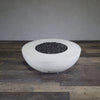 A side view of the Starfire Designs Gravity 45" Round Rustic Gravity Concrete (GFRC) Fire Pit - Propane Gas Hardline - White with flames on, featuring sleek modern concrete bowl design and durable construction, perfect for outdoor patio spaces. Natural gas or propane compatible, enhancing warmth and ambiance. Lava rocks included for added aesthetic.
