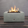 Front view of Starfire Designs Gravity 36" Square Rustic Gravity Concrete (GFRC) Fire Pit - Propane Gas Hardline - Natural Gray with flames on, featuring sleek modern concrete bowl design and durable construction, perfect for outdoor patio spaces. Natural gas or propane compatible, enhancing warmth and ambiance. Lava rocks included for added aesthetic.
