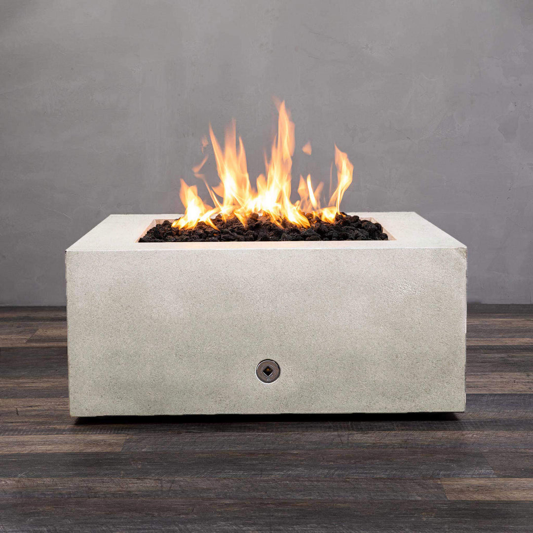 Front view of Starfire Designs Gravity 36" Square Rustic Gravity Concrete (GFRC) Fire Pit - Propane Gas Hardline - White with flames on, featuring sleek modern concrete bowl design and durable construction, perfect for outdoor patio spaces. Natural gas or propane compatible, enhancing warmth and ambiance. Lava rocks included for added aesthetic.
