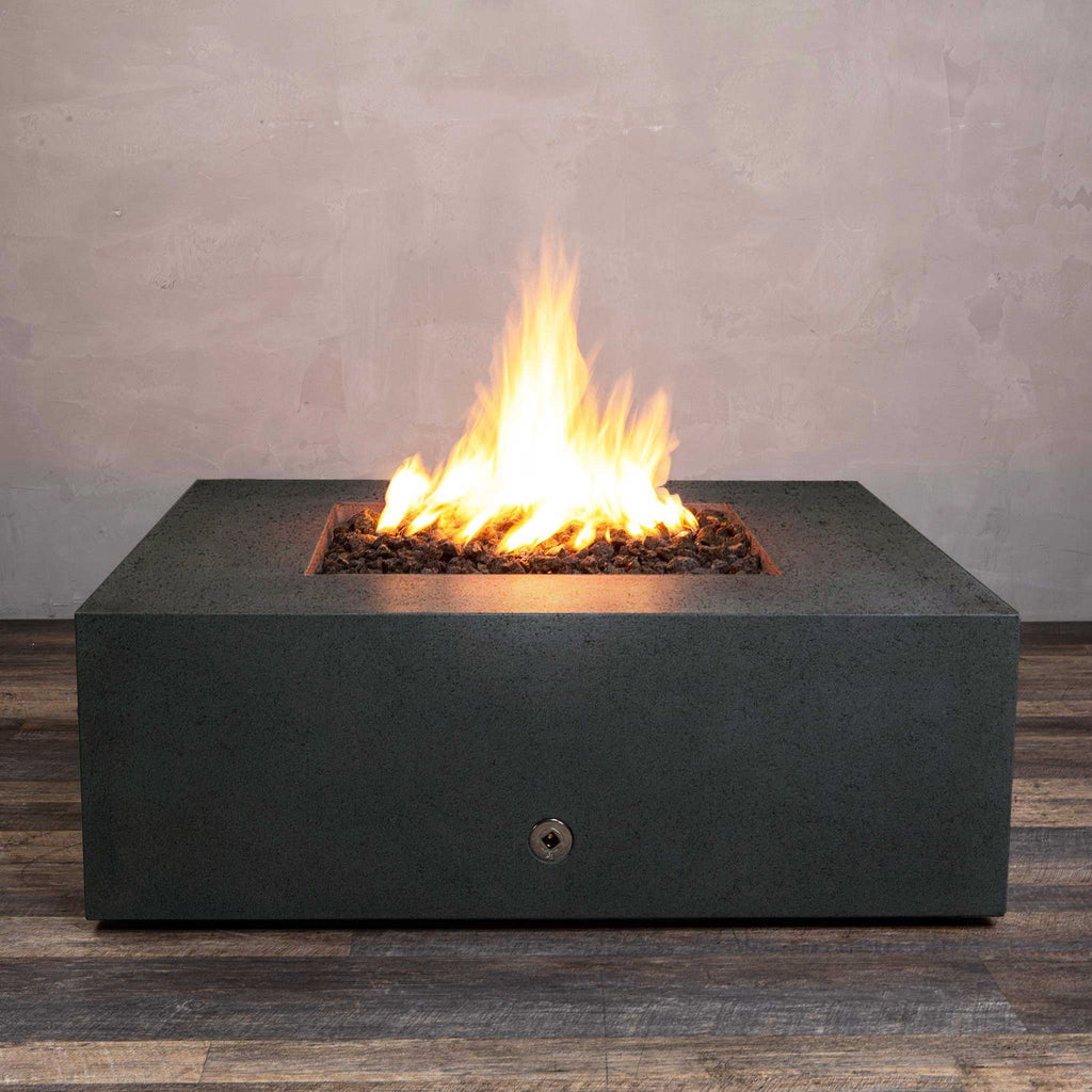 Front view of Starfire Designs Gravity 45" Square Rustic Gravity Concrete (GFRC) Fire Pit - Propane Gas Hardline - Graphite with flames on, featuring sleek modern concrete bowl design and durable construction, perfect for outdoor patio spaces. Natural gas or propane compatible, enhancing warmth and ambiance. Lava rocks included for added aesthetic.
