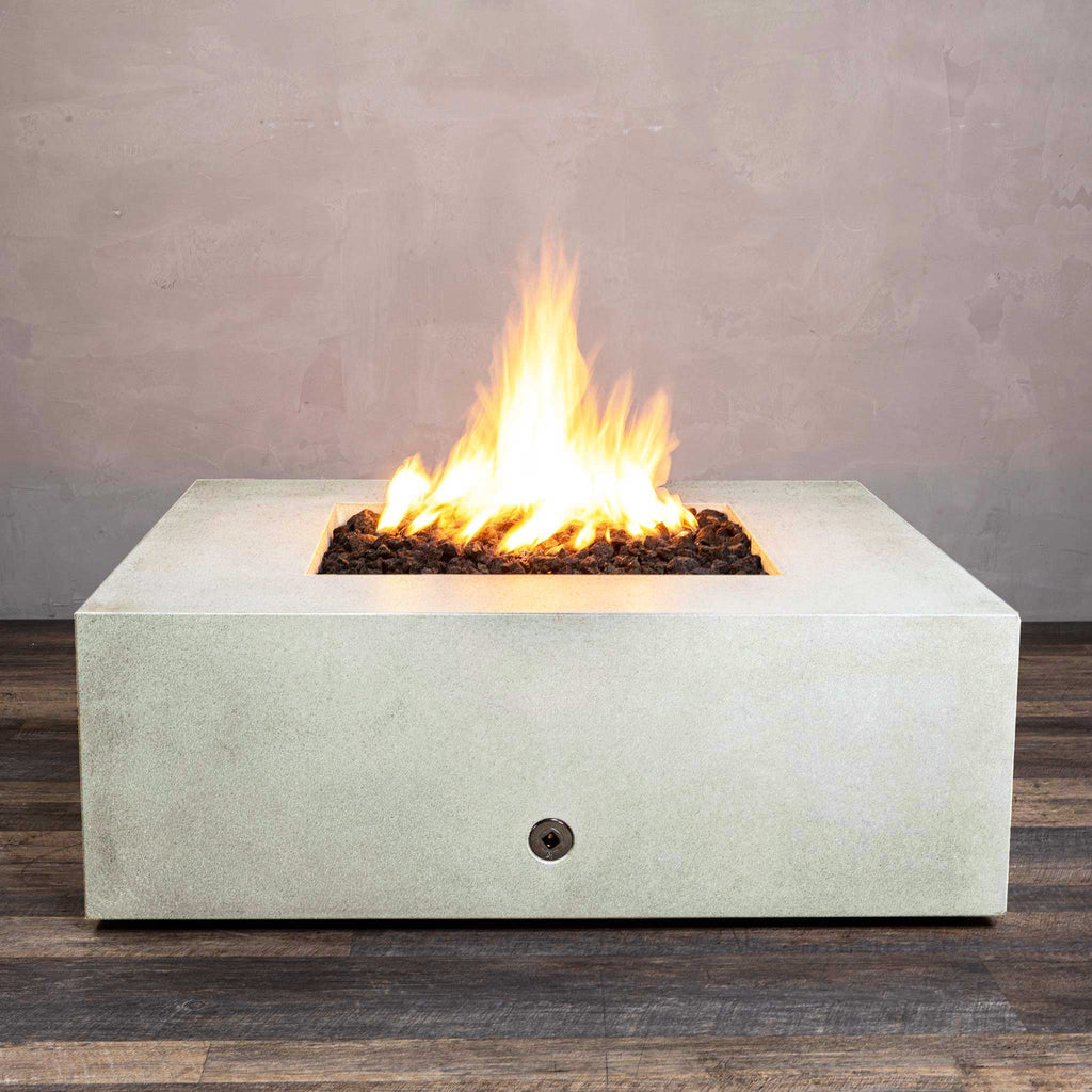 Front view of Starfire Designs Gravity 45" Square Rustic Gravity Concrete (GFRC) Fire Pit - Propane Gas Hardline - White with flames on, featuring sleek modern concrete bowl design and durable construction, perfect for outdoor patio spaces. Natural gas or propane compatible, enhancing warmth and ambiance. Lava rocks included for added aesthetic.
