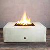 Front view of Starfire Designs Gravity 45" Square Rustic Gravity Concrete (GFRC) Fire Pit - Propane Gas Hardline - White with flames on, featuring sleek modern concrete bowl design and durable construction, perfect for outdoor patio spaces. Natural gas or propane compatible, enhancing warmth and ambiance. Lava rocks included for added aesthetic.
