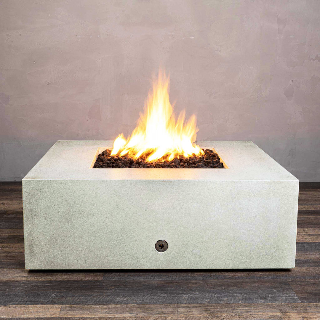 Front view of Starfire Designs Gravity 45" Square Rustic Gravity Concrete (GFRC) Fire Pit - Propane Gas Hardline - White with flames on, featuring sleek modern concrete bowl design and durable construction, perfect for outdoor patio spaces. Natural gas or propane compatible, enhancing warmth and ambiance. Lava rocks included for added aesthetic.
