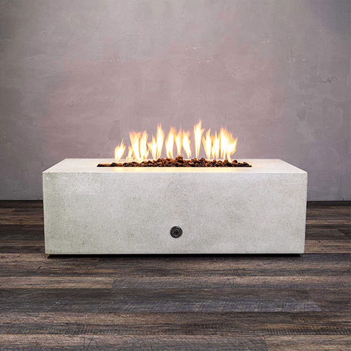 Front view of Starfire Designs Gravity 48" x 32" Rectangle Rustic Gravity Concrete (GFRC) Fire Pit - Propane Gas Hardline - White with flames on, featuring sleek modern concrete bowl design and durable construction, perfect for outdoor patio spaces. Natural gas or propane compatible, enhancing warmth and ambiance. Lava rocks included for added aesthetic.
