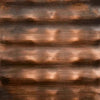 Close-up of The Outdoor Plus hammered copper metal finish, showcasing its handcrafted texture and warm, reflective reddish-brown tones / ideal for rustic or traditional outdoor fire features.