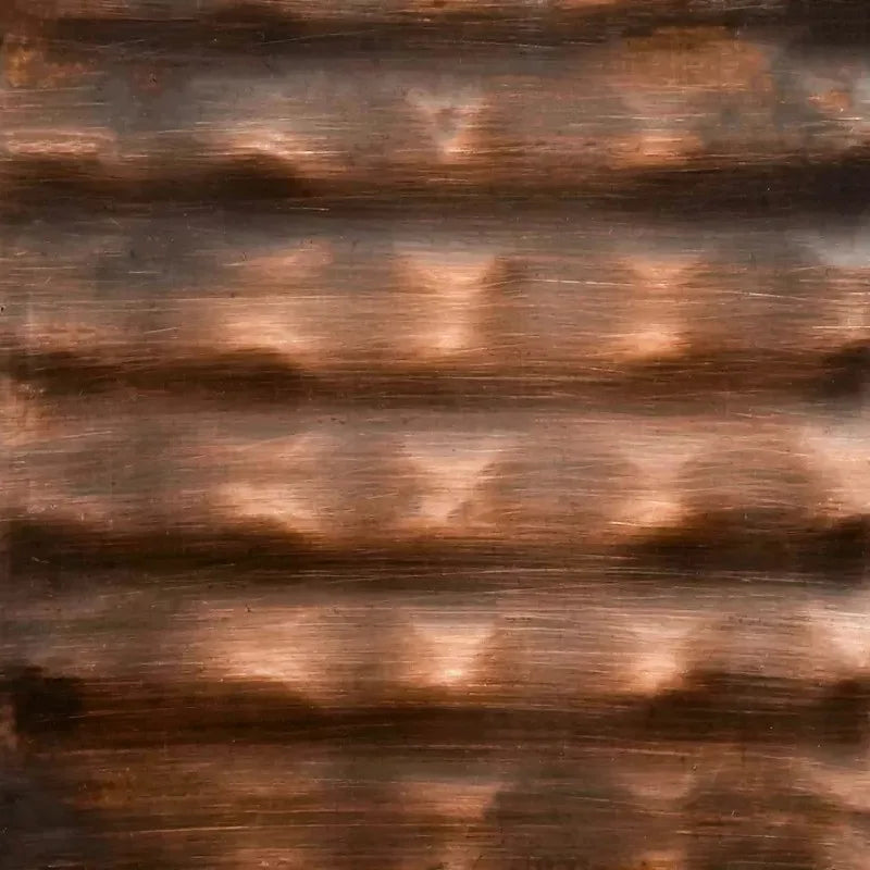 Close-up of The Outdoor Plus hammered copper metal finish, showcasing its handcrafted texture and warm, reflective reddish-brown tones / ideal for rustic or traditional outdoor fire features.