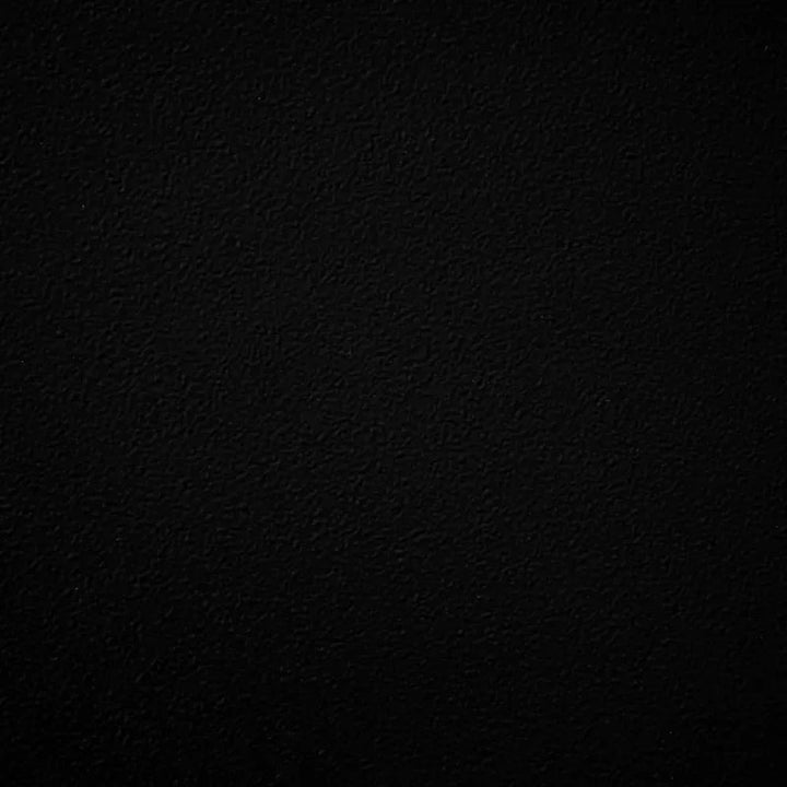 Matte black powder-coated metal swatch with a subtly textured finish, providing bold contrast and timeless sophistication for outdoor fire pits and bowls.