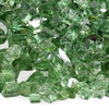 Close-up of American Fire Products 1/4" Evergreen Reflective Fire Glass showcasing lush green glass chips with shimmering mirrored surfaces, ideal for adding vibrant color and sparkling elegance to any fire feature.