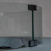 Closeup view of the Starfire Designs Beton Round Glass Wind Guard corner bracket, showcasing the sleek design and secure glass connection