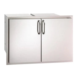 Fire Magic stainless steel double access doors for BBQ island, offering sleek and durable storage options for outdoor kitchens and grilling areas