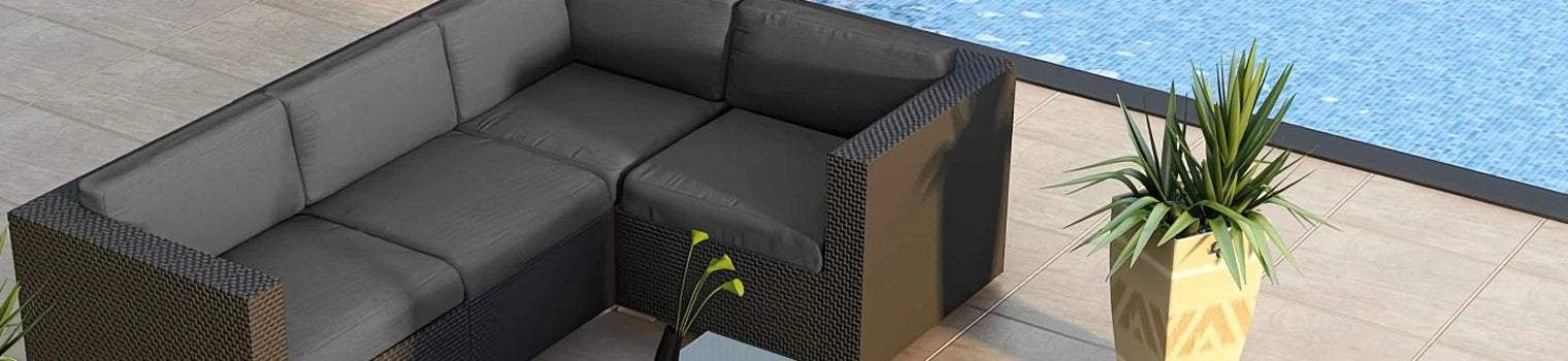 Modern outdoor sectional sofa with gray cushions placed beside a swimming pool, complemented by a potted plant, creating a stylish and comfortable poolside seating area