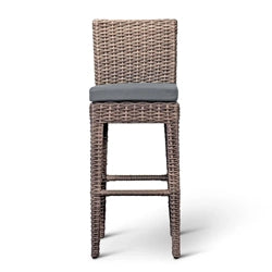 Outdoor wicker bar stool with a cushioned seat in a natural rattan finish, ideal for patio bar areas