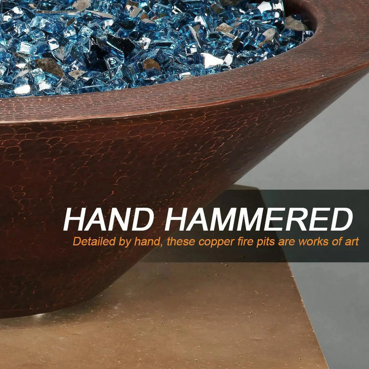 Close-up of the hand-hammered copper finish on the Cono Moreno 31-inch Round Copper Fire and Water Bowl by Starfire Designs, highlighting the intricate craftsmanship and vibrant blue fire glass, perfect for luxury outdoor fire pits