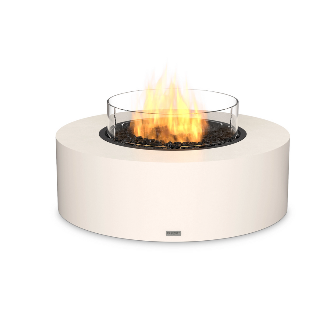 EcoSmart Fire Ark 40 in bone finish with a propane burner and glass wind guard, delivering a modern fire pit experience. This outdoor gas fire pit features a round, durable concrete base that complements luxury patio designs. The glass wind guard enhances flame stability, making it an excellent choice for backyard fire pits, high-end outdoor spaces, and commercial fire pit settings.