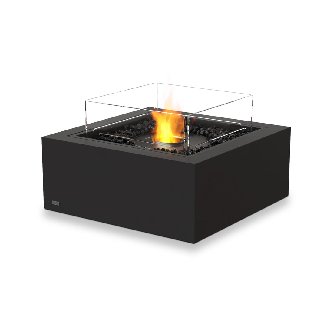 The EcoSmart Fire Base 30 Graphite ethanol fire pit features a sleek black finish with a black burner and a glass wind guard, enhancing safety and stability. Its modern fire pit design is perfect for outdoor and indoor use, offering a smokeless flame with eco-friendly ethanol fuel. The graphite color adds a sophisticated touch to patios, decks, and commercial spaces