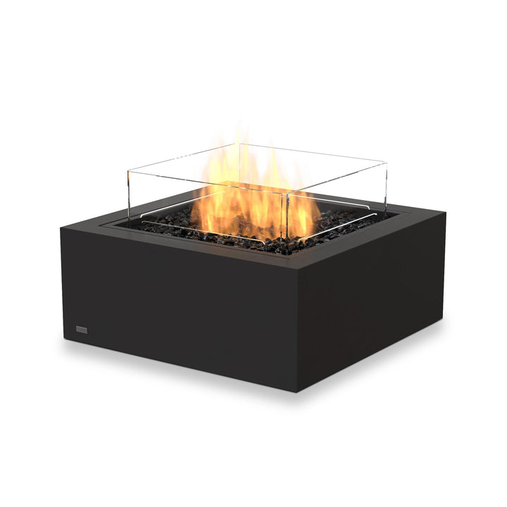 The EcoSmart Fire Base 30 Graphite propane fire pit features a glass wind guard, ensuring flame stability in outdoor environments. Its graphite-colored concrete base and high-performance burner make it a modern and durable fire feature, perfect for backyard entertaining, commercial patios, and luxury outdoor spaces.
