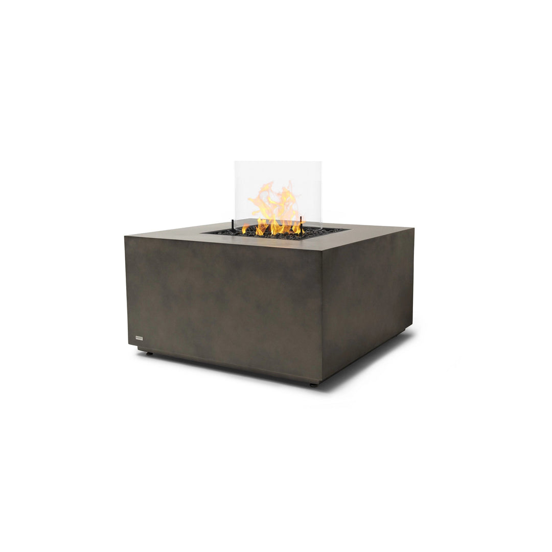 A sophisticated EcoSmart Fire Chaser 38 Natural propane fire pit, equipped with a glass wind guard to stabilize flames. Its high-quality concrete finish and propane gas burner make it an excellent choice for patios, decks, and outdoor entertaining areas.