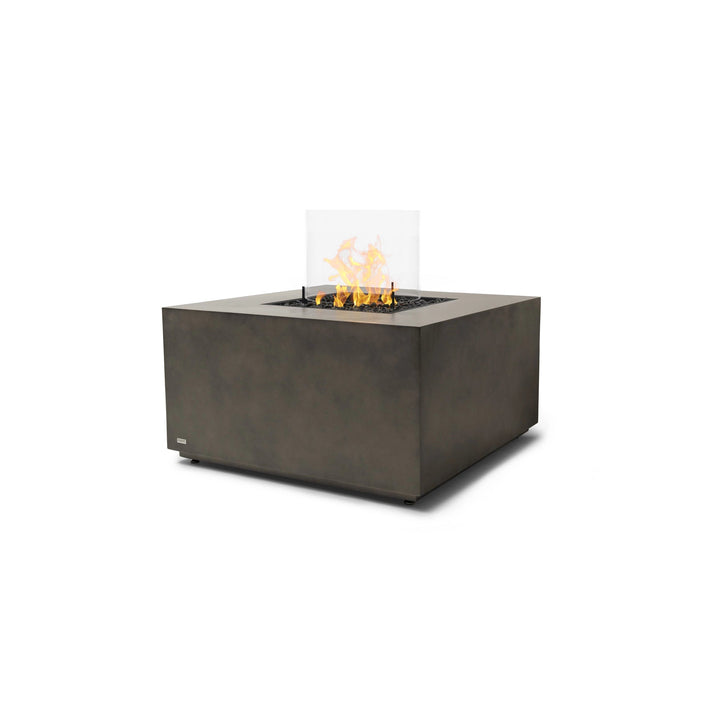 A sophisticated EcoSmart Fire Chaser 38 Natural propane fire pit, equipped with a glass wind guard to stabilize flames. Its high-quality concrete finish and propane gas burner make it an excellent choice for patios, decks, and outdoor entertaining areas.