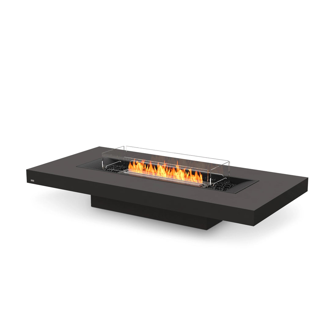 The EcoSmart Fire Gin 90 Low Graphite Fire Pit Table features a sleek black burner with a wind guard for added safety. This modern outdoor fire pit is designed for luxury patios, offering a long, rectangular gas fire table that enhances any contemporary outdoor space. Perfect for use as a fire pit coffee table, this unit provides elegant ambiance and high-performance heating.