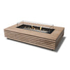EcoSmart Fire Wharf 50 Teak outdoor fire pit with a black burner and glass wind guard. This modern fire table features a slatted teak wood frame with a sleek rectangular design, offering a stylish and functional fire pit for contemporary outdoor spaces. The natural gas fire pit produces a warm, inviting flame over black fire glass. Perfect for backyard patios, modern decks, and high-end commercial settings.

