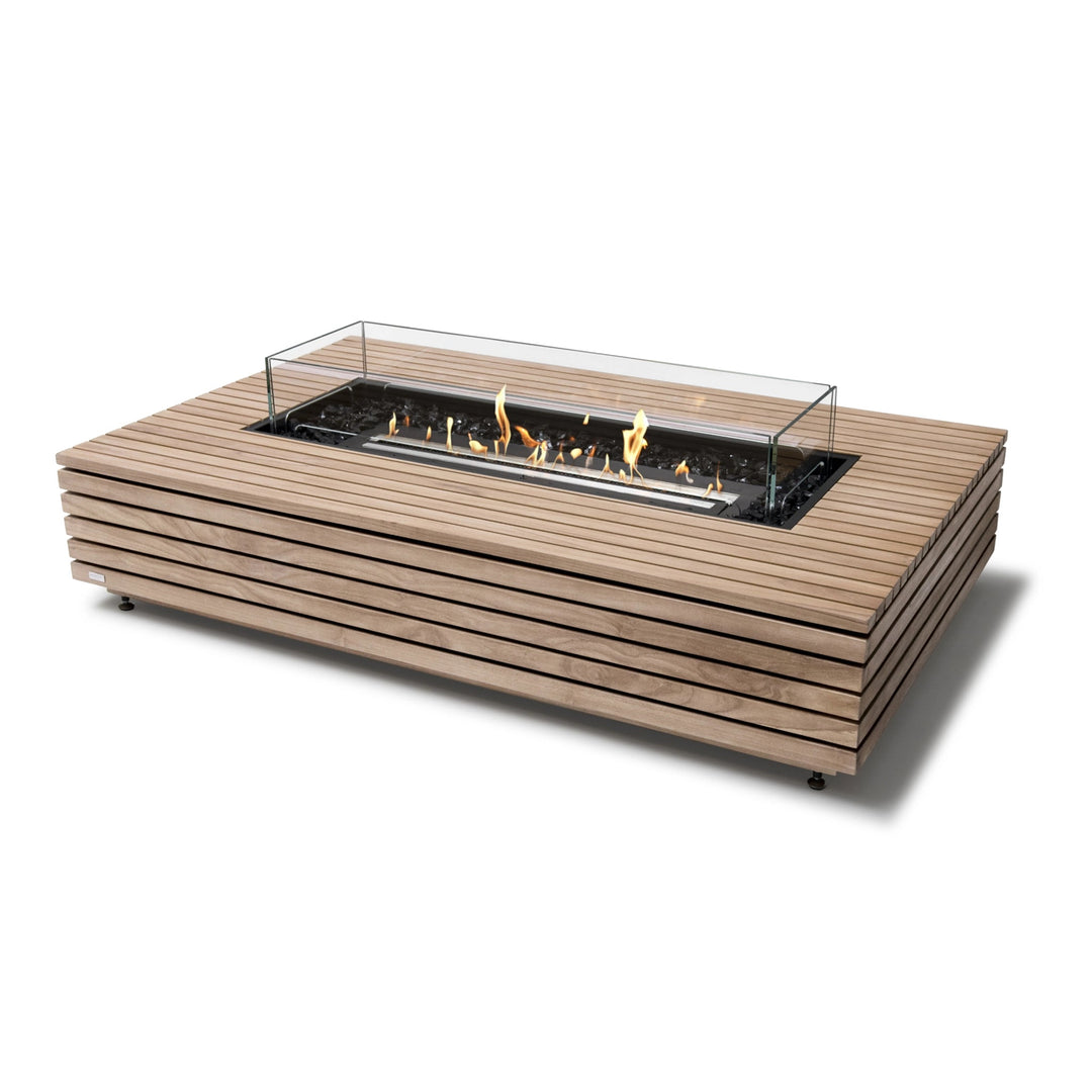 EcoSmart Fire Wharf 50 Teak outdoor fire pit with a black burner and glass wind guard. This modern fire table features a slatted teak wood frame with a sleek rectangular design, offering a stylish and functional fire pit for contemporary outdoor spaces. The natural gas fire pit produces a warm, inviting flame over black fire glass. Perfect for backyard patios, modern decks, and high-end commercial settings.

