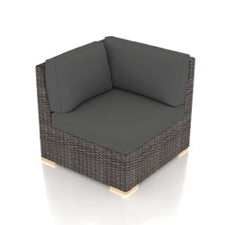 A modern outdoor sectional corner piece featuring a woven wicker frame with dark gray cushions. The piece has a sleek and minimalist design, perfect for creating a customizable and comfortable outdoor seating arrangement on patios or in garden areas.