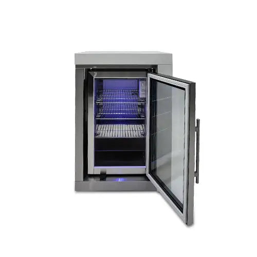 A stainless steel outdoor kitchen built-in BBQ refrigerator designed for the outside elements has it's front door open with a blue visual light is presented on a white background