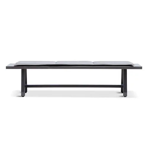 A gray modern dining bench is on display on a white background