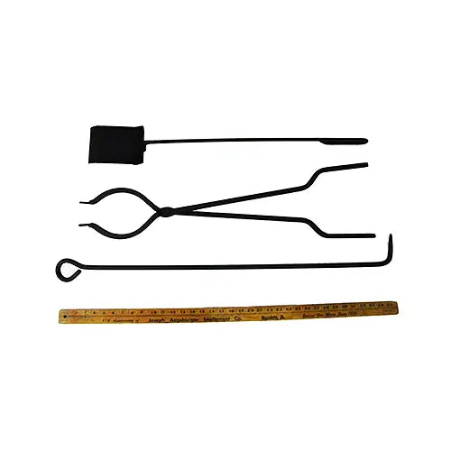 several fire pit accessories are on display for wood and gas burning fir epits including a shovel and a ruler on a white background