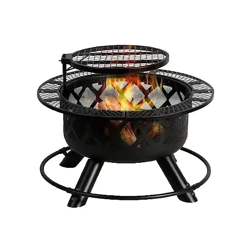 a black steel wood burning fire pit is on fire with a steel cooking grate floating above the central heat for cooking