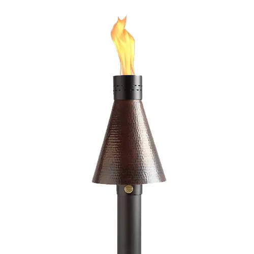 the tall head of a copper tiki torch is burning brightly on a white background
