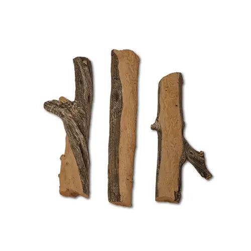 several fake handpainted gas logs that look real set apart on a white background