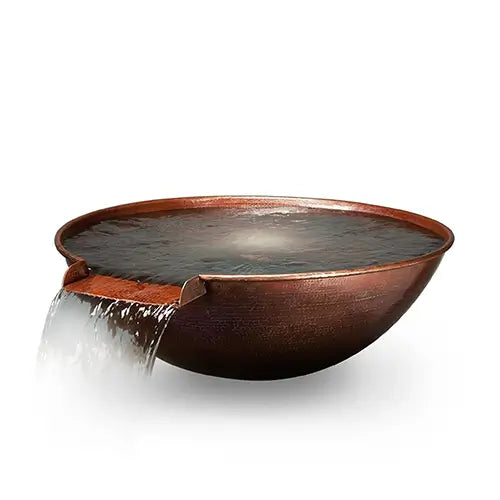 A copper fire bowl filled with water spilling out onto a white background
