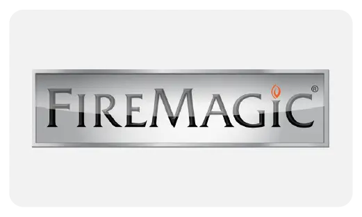 The Fire Magic logo featuring the brand name on a stylized stainless steel plaque icon, representing their luxury drop-in grills and outdoor kitchen products.