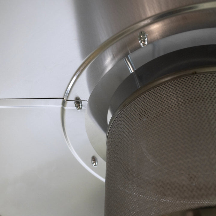 Detailed close-up of the Golden Flame Outdoor Natural Gas Patio Heater’s stainless steel heat deflector and mesh burner cover. The image captures the high-quality materials and meticulous assembly, featuring securely fastened bolts and a seamless integration of the deflector and mesh cover to ensure optimal heat distribution and safety. The polished stainless steel surface reflects light, adding a modern touch to the patio heater's design, while the mesh cover protects the burner, enhancing longevity and ef