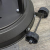 Close-up of the Golden Flame Outdoor Natural Gas Patio Heater’s wheeled base, showcasing the heavy-duty dual wheels and sturdy construction. The image focuses on the detailed assembly of the wheeled support bracket, which is securely attached to the bottom of the heater. Designed for ease of mobility, the integrated wheels allow the heater to be effortlessly relocated to different areas of the patio. The matte black finish and robust design add to the heater’s durability, making it ideal for both commercial