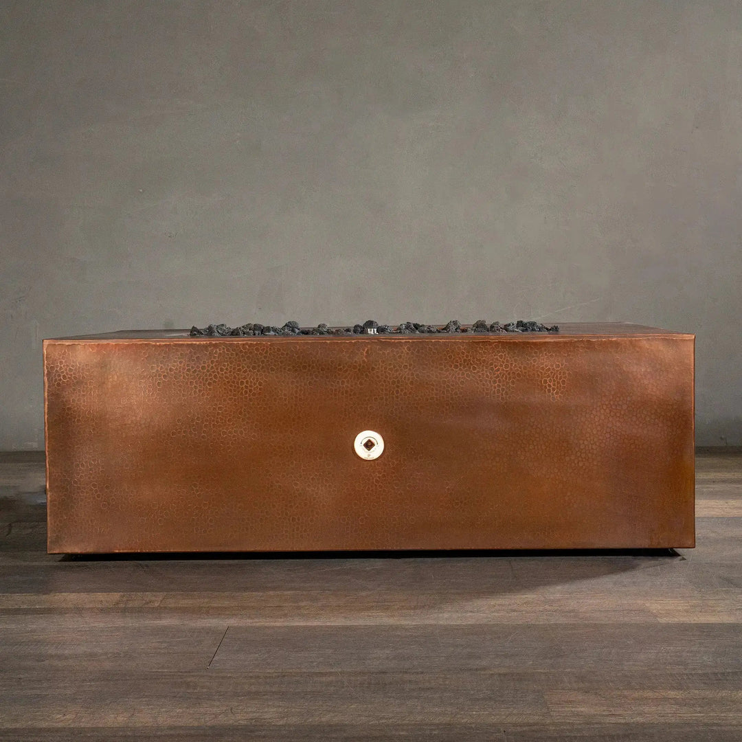 Back view of Gravity Moreno 48x32 rectangle copper fire pit, showcasing the sleek, hammered copper finish and rectangular design, ideal for luxurious outdoor settings