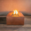 Front view of the Gravity Moreno 60x32 rectangular copper fire pit by Starfire Designs, featuring a vibrant flame and handcrafted copper finish, perfect for enhancing outdoor living spaces with a touch of luxury