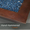 Detailed view of the hand-hammered copper finish on the Largo Moreno 60-inch x 26-inch Rectangle Copper Fire Pit, showcasing blue fire glass