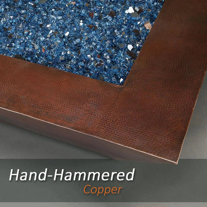 Detailed view of the hand-hammered copper finish on the Largo Moreno 60-inch x 26-inch Rectangle Copper Fire Pit, showcasing blue fire glass
