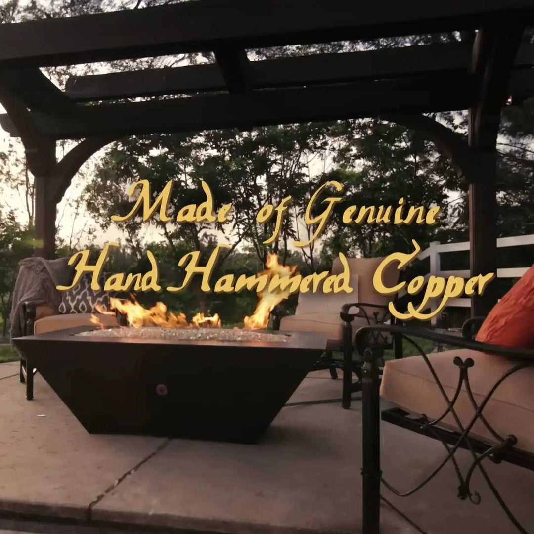Largo Moreno 60-inch x 26-inch Rectangle Copper Fire Pit, featuring genuine hand-hammered copper craftsmanship under a pergola