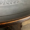 Close-up of the Golden Flame Malibu 44” Round Cast Aluminum Natural Gas Fire Table's edge, showing its smooth textured finish with bronze accents for a refined outdoor aesthetic.