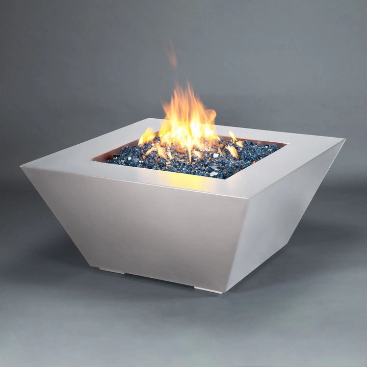 Side corner view of the Mill 40-inch Square Steel Gas Fire Pit - White Hammertone, highlighting the sleek design and vibrant flame. A perfect addition to any modern outdoor patio