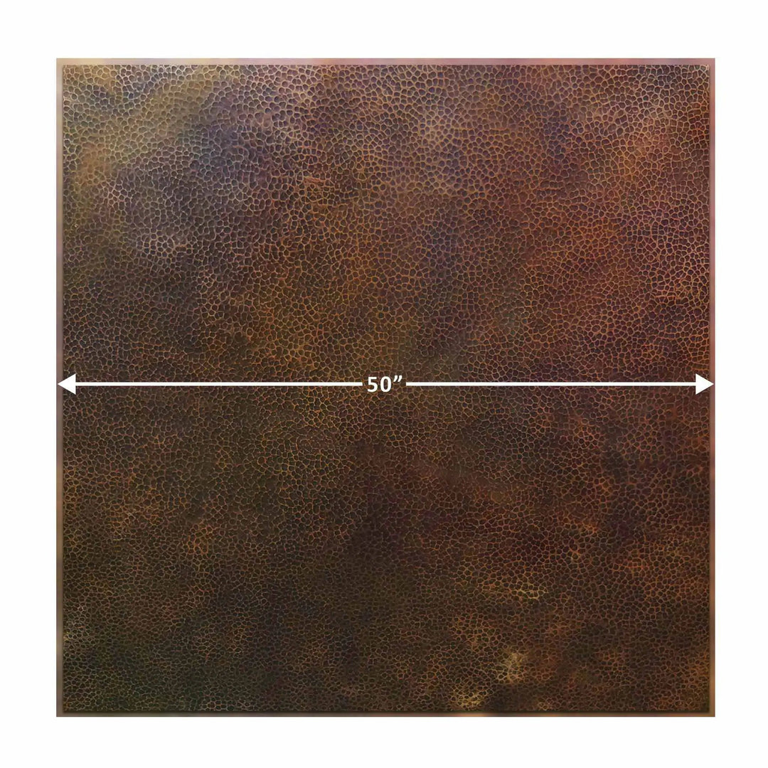 Moreno 50-inch square copper fire pit cover in a close-up view, highlighting the unique hand-hammered texture that defines its high-quality copper construction. Featuring built-in brass handles for easy portability, this lid offers reliable protection for fire pits. The fire pit lid’s rich copper finish makes it a stylish and practical addition to outdoor living spaces