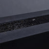 A focused close-up of extra small black volcanic lava rocks resting inside a fire pit. Their distinct porous surface gives them a natural aesthetic, perfect for outdoor and indoor fire features. The durable volcanic material is ideal for high-heat environments, adding both function and style to any fire setup.