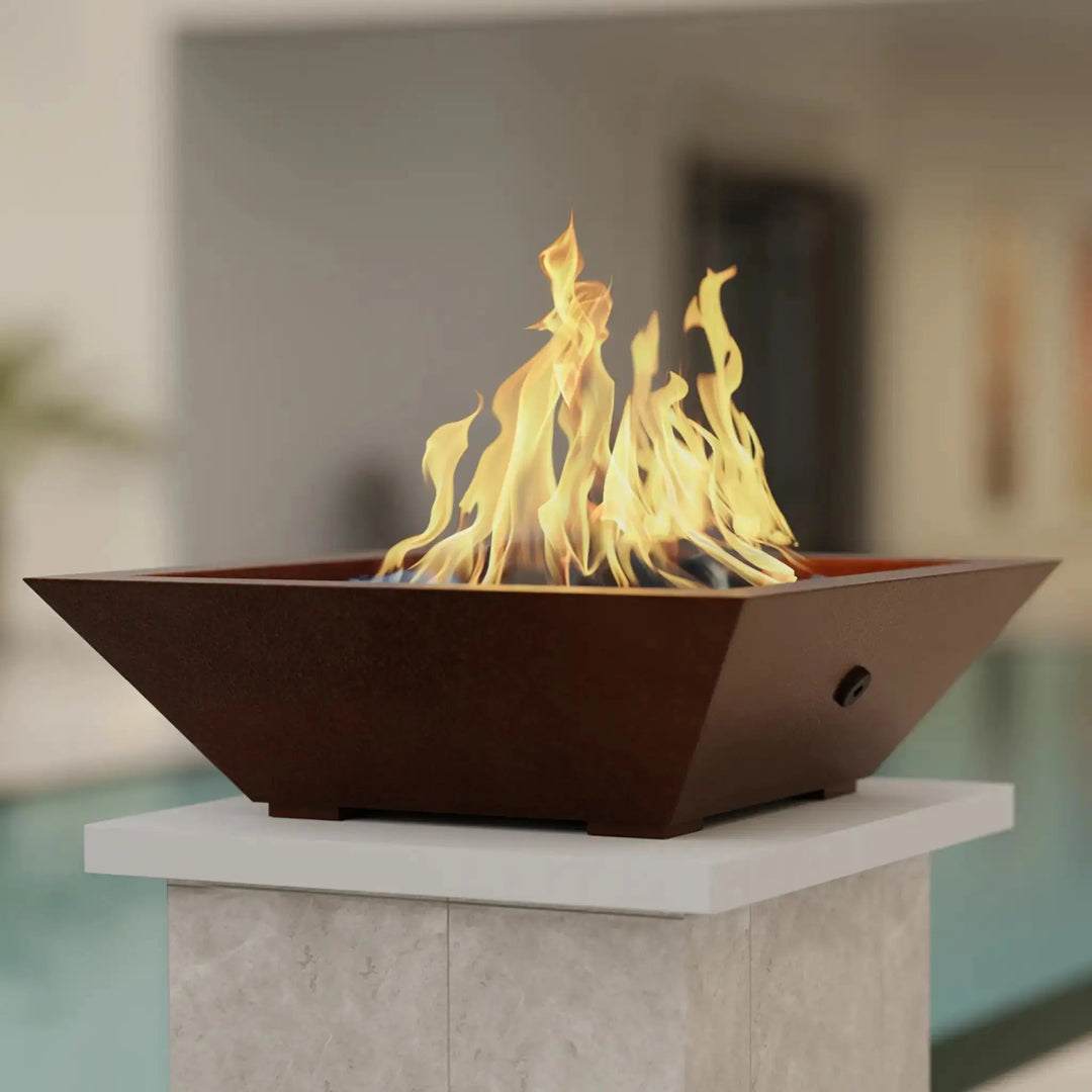 Square copper fire pit lid on Plaza Moreno 29-inch W Square Copper Fire Bowl, featuring hand-hammered copper finish