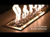 Video of American Fire Products 1/4" Bronze Reflective Fire Glass dancing beneath vibrant flames in a modern fire pit—highlighting the glass’s rich, smoky hue and glimmering reflective finish that adds warmth and elegance to any outdoor setting.