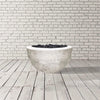 Prism Hardscapes Moderno 3 Gas Fire Bowl in natural finish, featuring a modern round bowl shape in a light natural concrete tone. This elegant gas fire pit is designed to complement any outdoor space, with a durable construction ideal for patios and backyard settings. Includes black lava rock for a modern, clean aesthetic. Perfect for creating a cozy outdoor environment. 