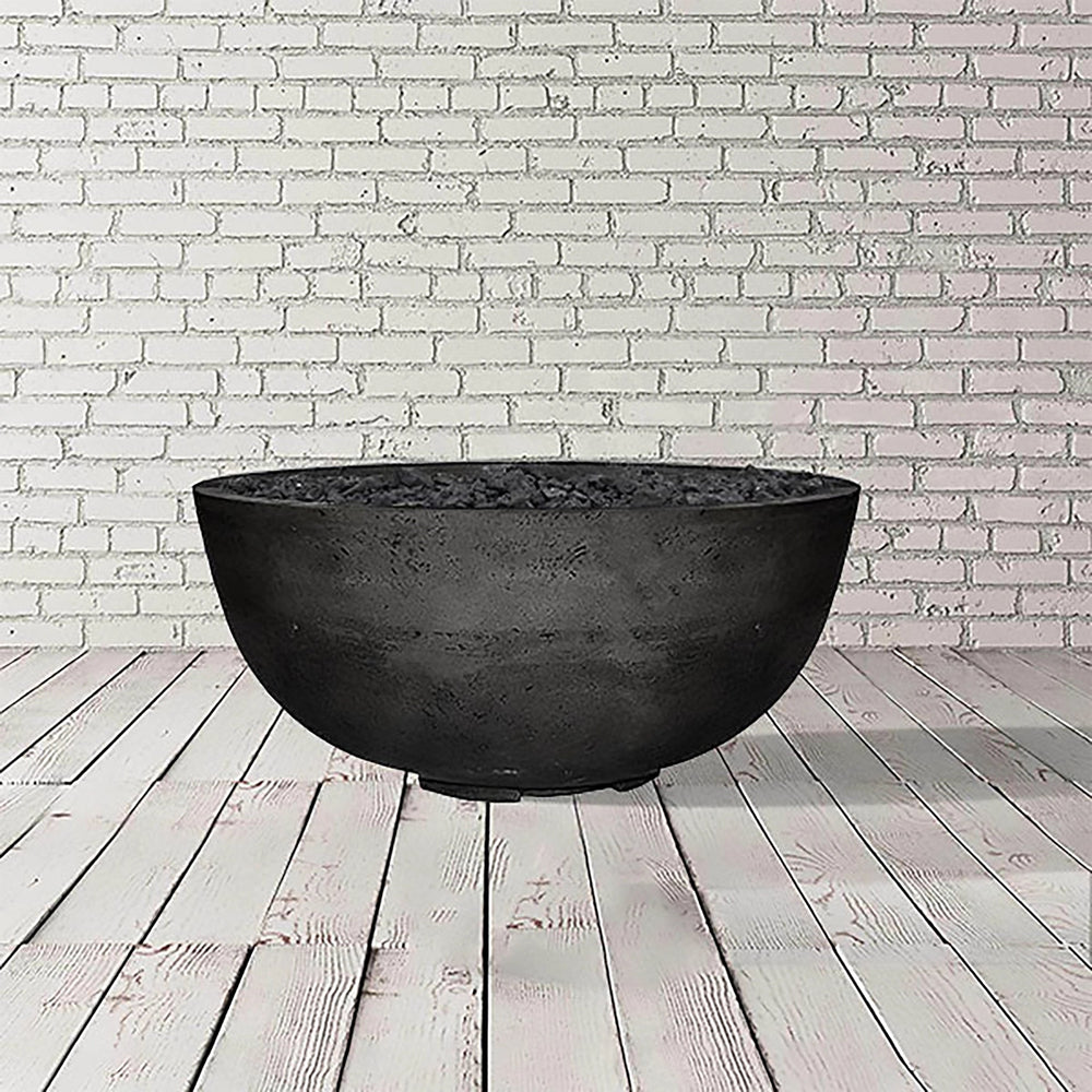 The Prism Hardscapes Moderno 1 Gas Fire Bowl in ebony, crafted with dark concrete, displays a bold and modern aesthetic. Perfect for outdoor fire bowls or fire pit tables, this large fire pit design creates a contemporary ambiance for your outdoor living space, making it an excellent addition to your backyard fire pit collection.